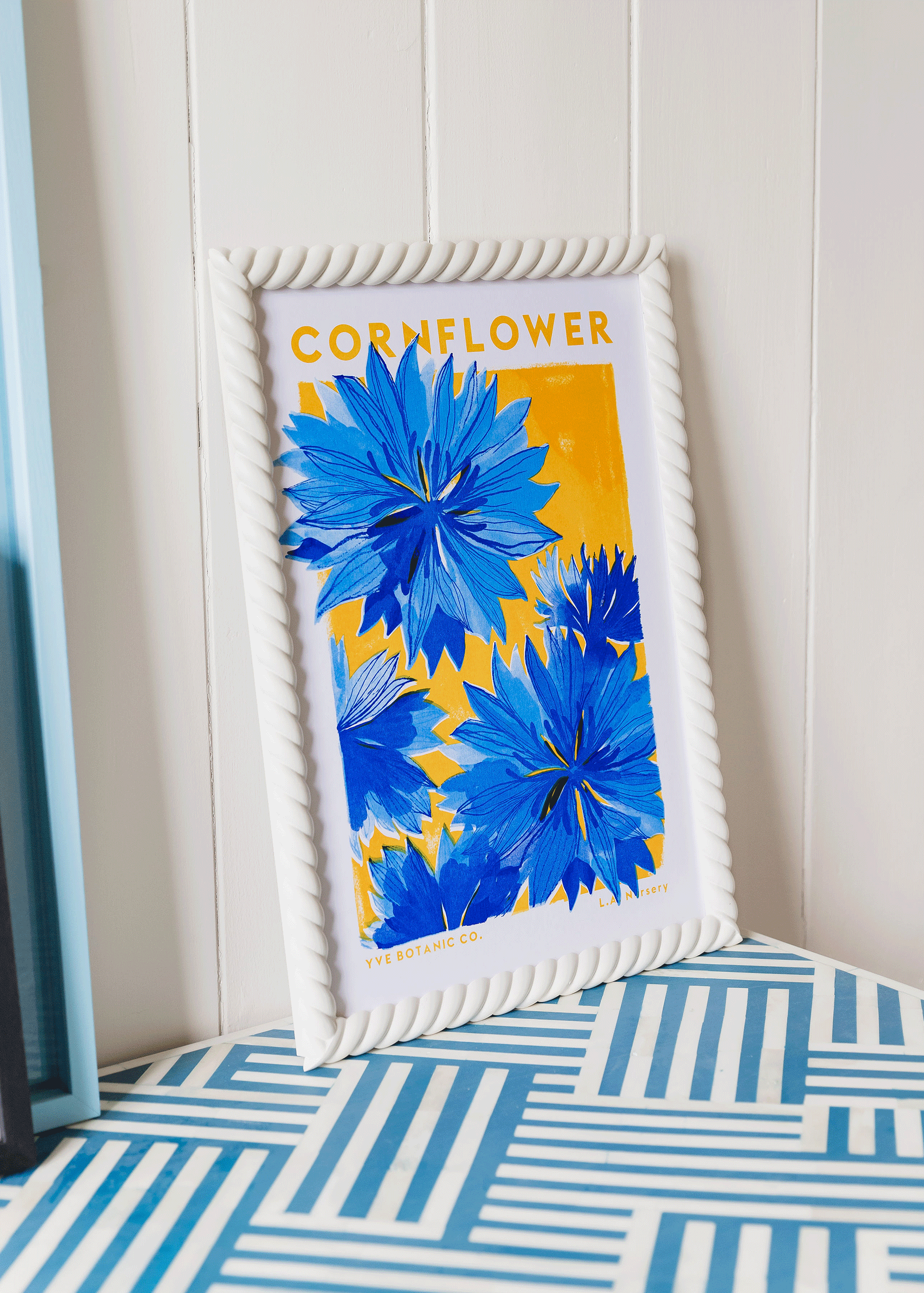 cornflower risograph print in sand rope frame